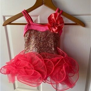 Weisman Costume Company presents this hot pink and gold sparkler. Tutu fabulous!